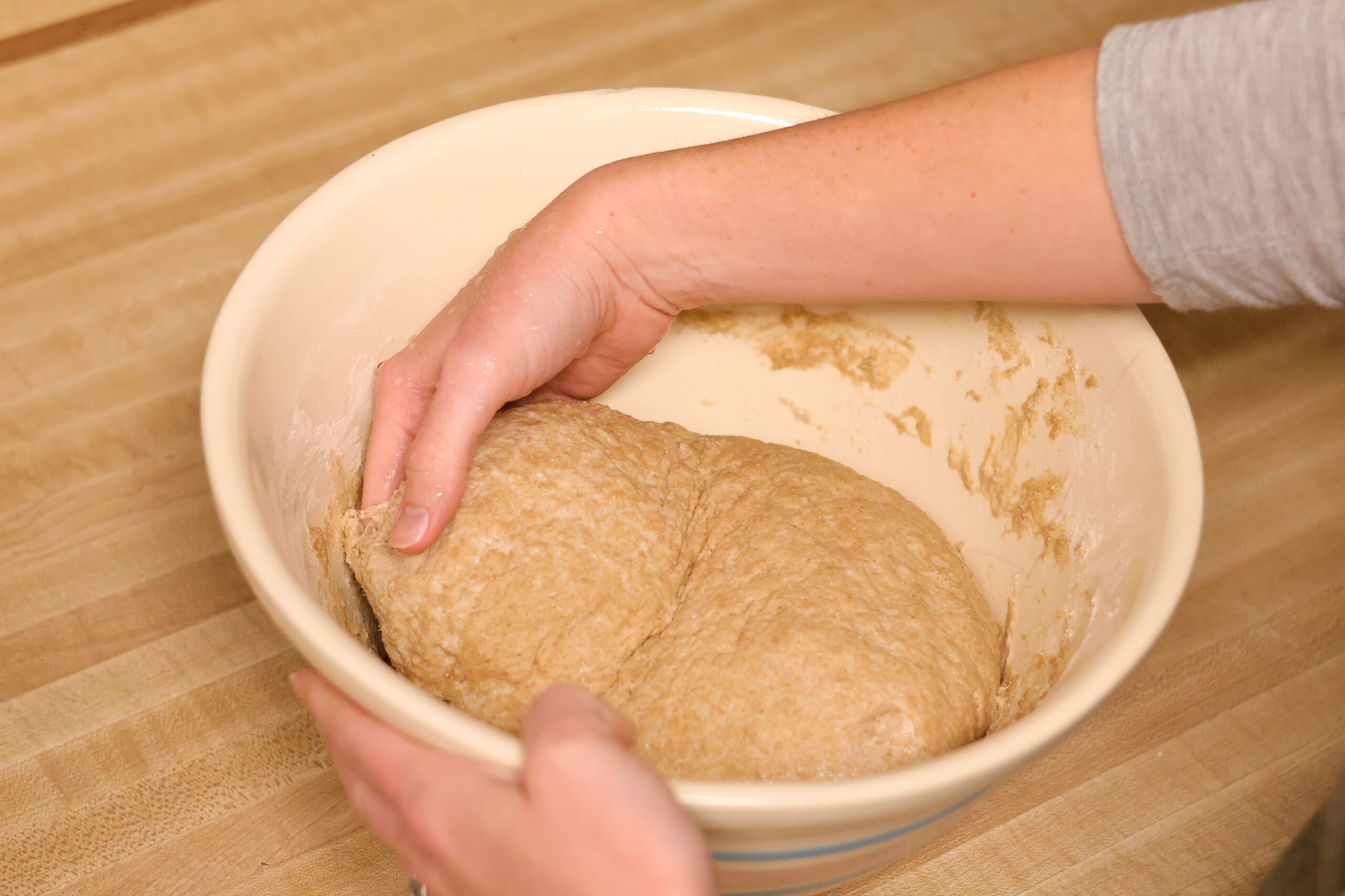 Process shot of how to stretch and fold sourdough