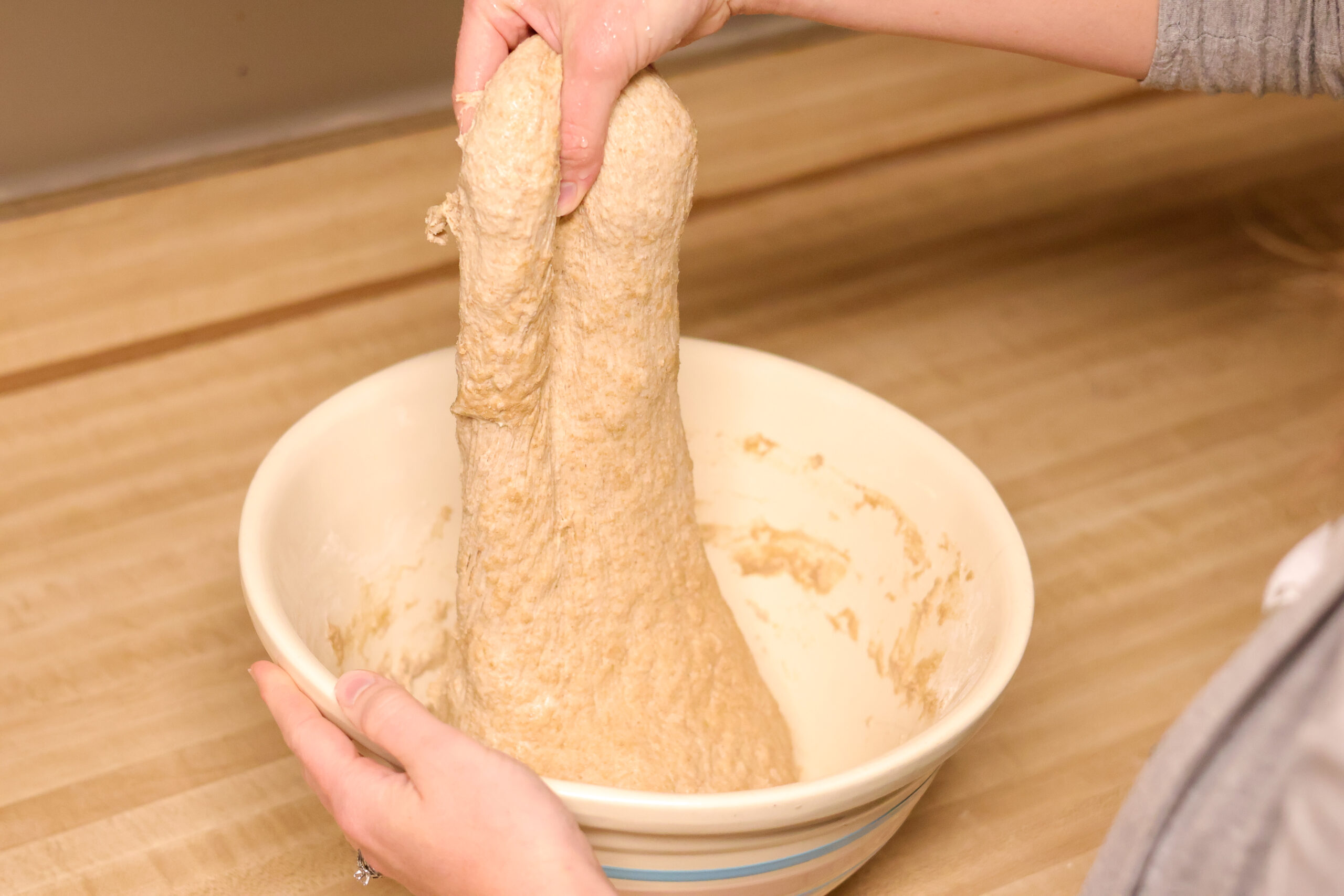 Process shot of how to stretch and fold sourdough