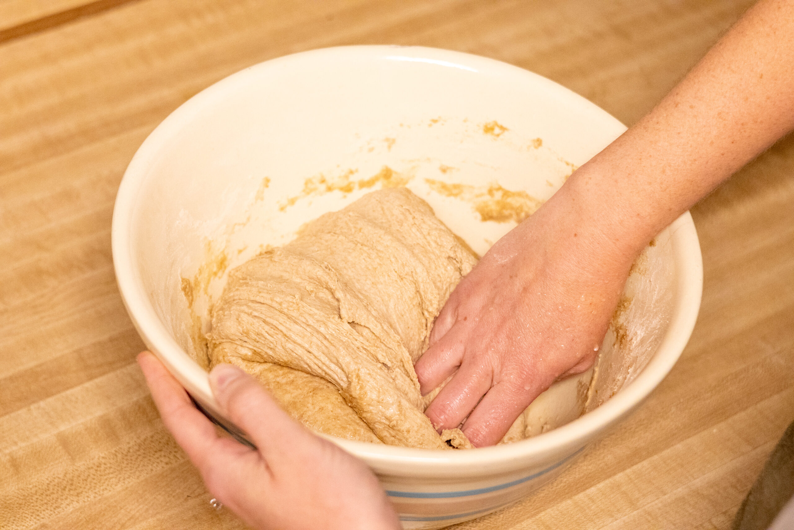 Process shot of how to stretch and fold sourdough
